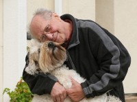 happy senior man and his dog