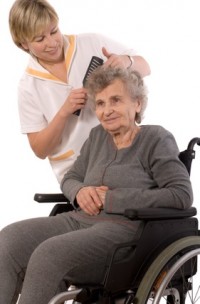 Nurse dressing the hair of a senior woman