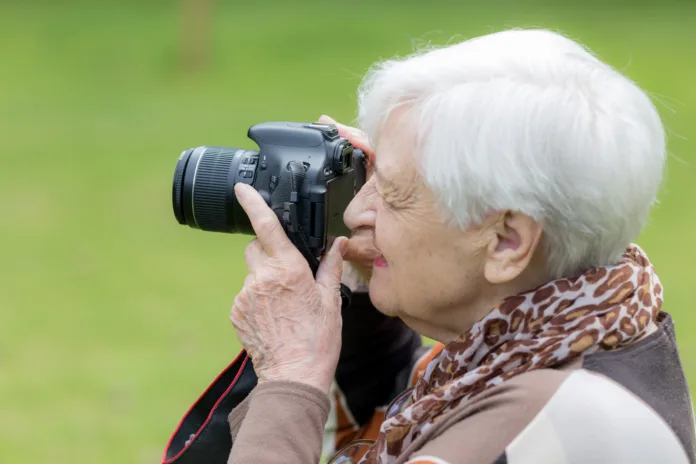 Senior women having fun using modern technology. Showing healthy and active lifestyle for seniors over 80 years old. No makeup.