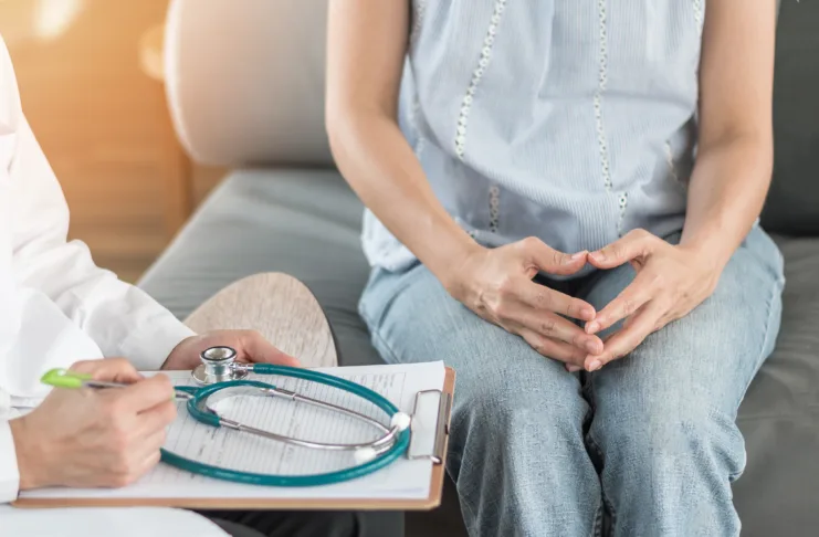 Doctor or psychiatrist consulting and diagnostic examining stressful woman patient on obstetric - gynecological female illness, or mental health in medical clinic or hospital healthcare service center