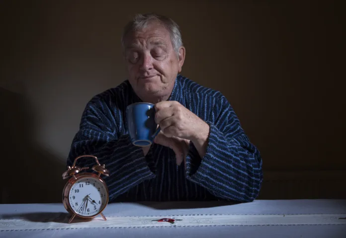 Mature man suffering from insomnia in the middle of the night