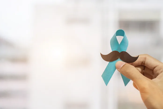 November Prostate Cancer Awareness month, Man holding Blue Ribbon with mustache  for supporting people living and illness. Healthcare, International men, Father and World cancer day concept