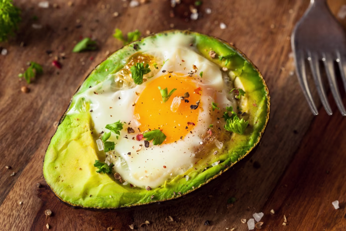 Homemade Organic Egg Baked in Avocado with Salt and Pepper