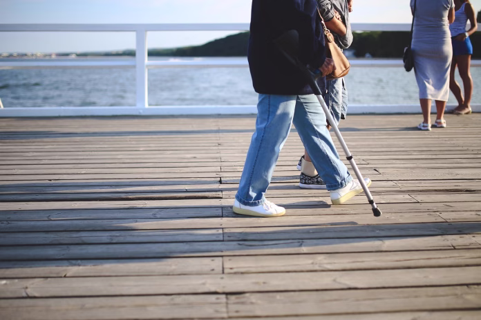 woman, crutch, old, walk, walking, jeans, injury, pier, hardworking, injury, injury, injury, injury, injury