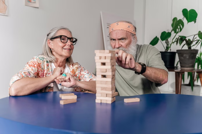 A couple playing a game of jenga