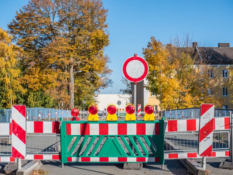 Complete closure of a road due to a construction site with a sign