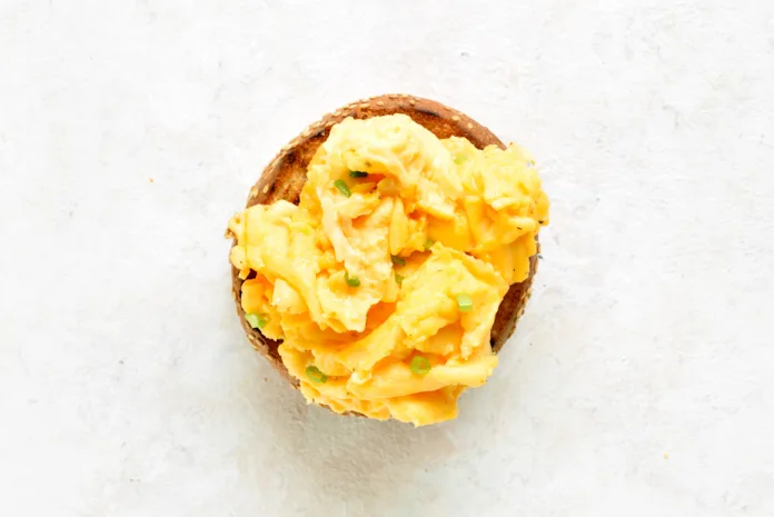 diet-scrambled-eggs-on-toasted-brioche-bun-on-light-background-tasty-meal-for-breakfast-or-brunch-top-view-flat-lay-stockpack-istock Diet scrambled eggs on toasted brioche bun on light background. Tasty meal for breakfast or brunch. Top view, flat lay