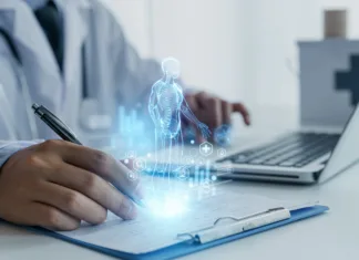 Na bolniški? Od danes veljajo nova pravila – preverite, kaj smete in česa ne A doctor uses a futuristic digital interface displaying a holographic human anatomy above a clipboard, symbolizing advanced AI in healthcare