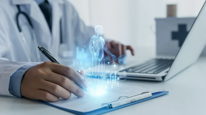 a-doctor-uses-a-futuristic-digital-interface-displaying-a-holographic-human-anatomy-above-a-clipboard-symbolizing-advanced-ai-in-healthcare-stockpack-istock A doctor uses a futuristic digital interface displaying a holographic human anatomy above a clipboard, symbolizing advanced AI in healthcare