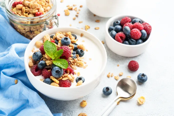 yogurt-with-fresh-berries-and-granola-on-white-table-healthy-snack-or-breakfast-diet-food-stockpack-istock Yogurt with fresh berries and granola on white table. Healthy snack or breakfast. Diet food.