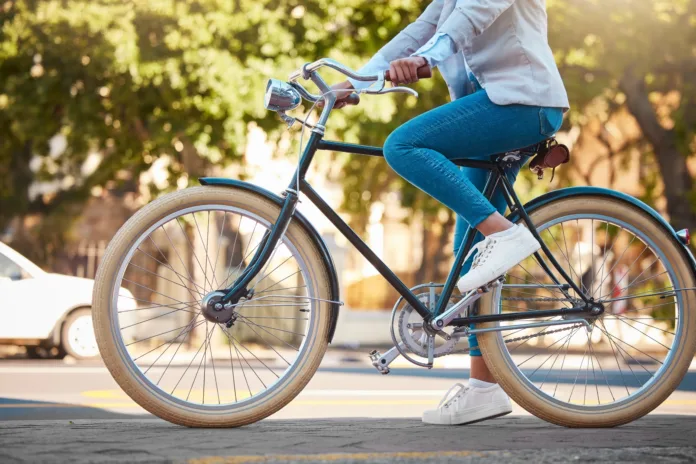 adventure-street-travel-and-bike-break-outdoor-in-urban-city-in-summer-woman-with-vintage-bicycle-in-a-road-for-transport-sustainability-person-traveling-with-health-mindset-or-healthy-energy-stockpack-istock Adventure, street travel and bike break outdoor in urban city in summer. Woman with vintage bicycle in a road for transport. Sustainability person traveling with health mindset or healthy energy