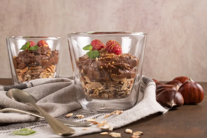 glass-cups-of-chocolate-and-chestnuts-mousse-with-roasted-almonds-and-oats-decorated-with-raspberry-and-mint-leaves-stockpack-istock Glass cups of chocolate and chestnuts mousse with roasted almonds and oats decorated with raspberry and mint leaves.