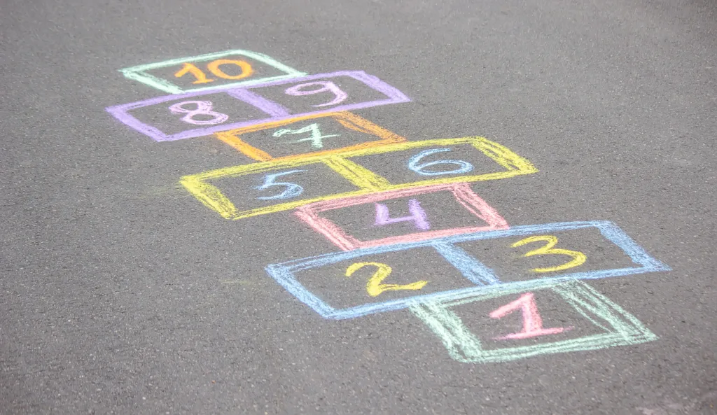 little girl plays hopscotch. Nature. selective focus