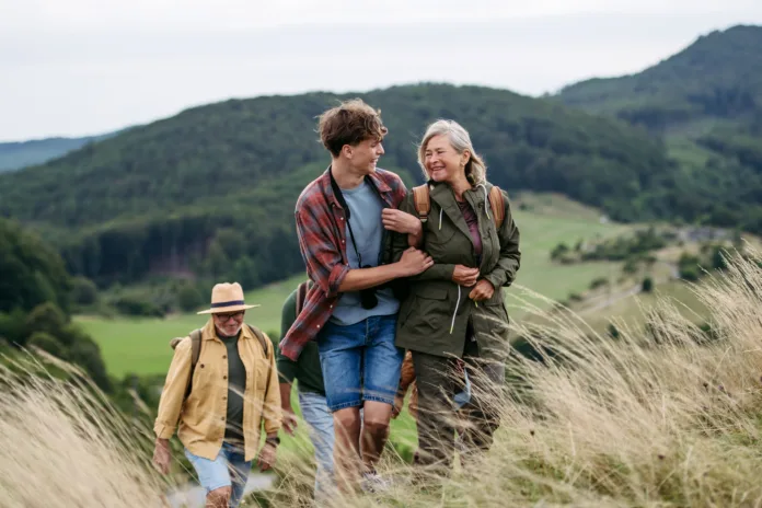 grandmother-and-teen-boy-on-hike-trip-multigenerational-family-in-autmn-nature-stockpack-istock Grandmother and teen boy on hike trip. Multigenerational family in autmn nature.